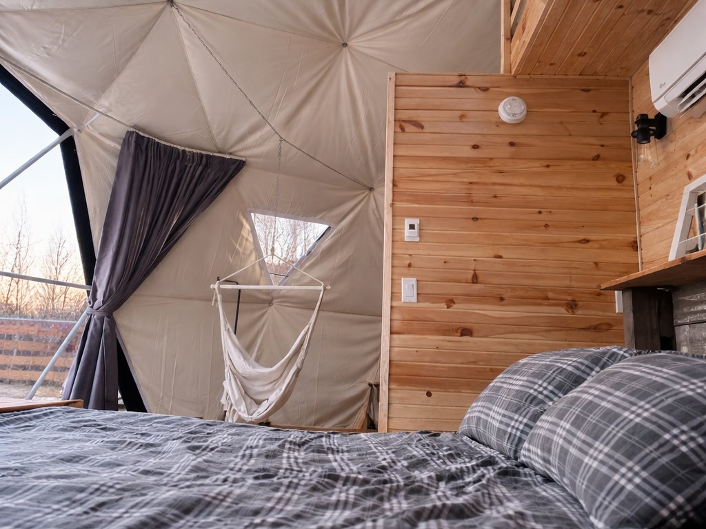 Birchwood Meadow — the bed and the hammock chair below the loft