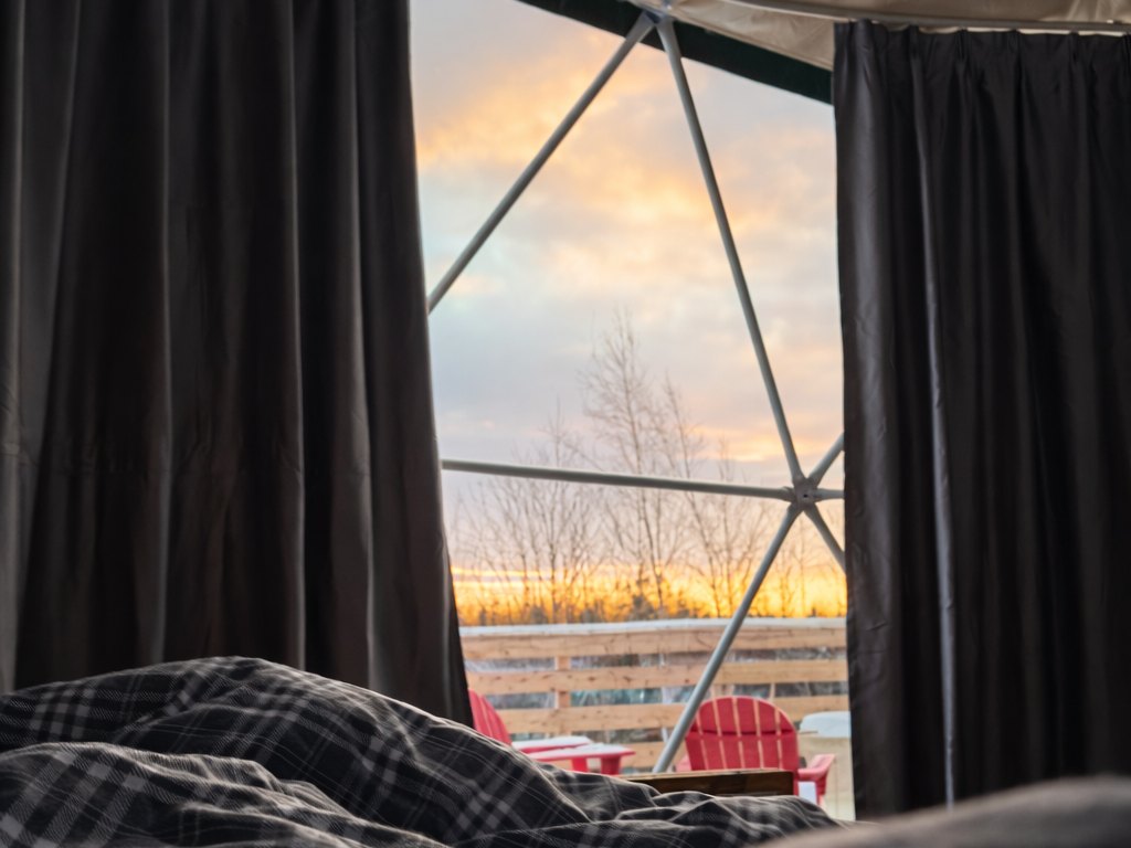 Birchwood Meadow — sunrise over the deck from the bed