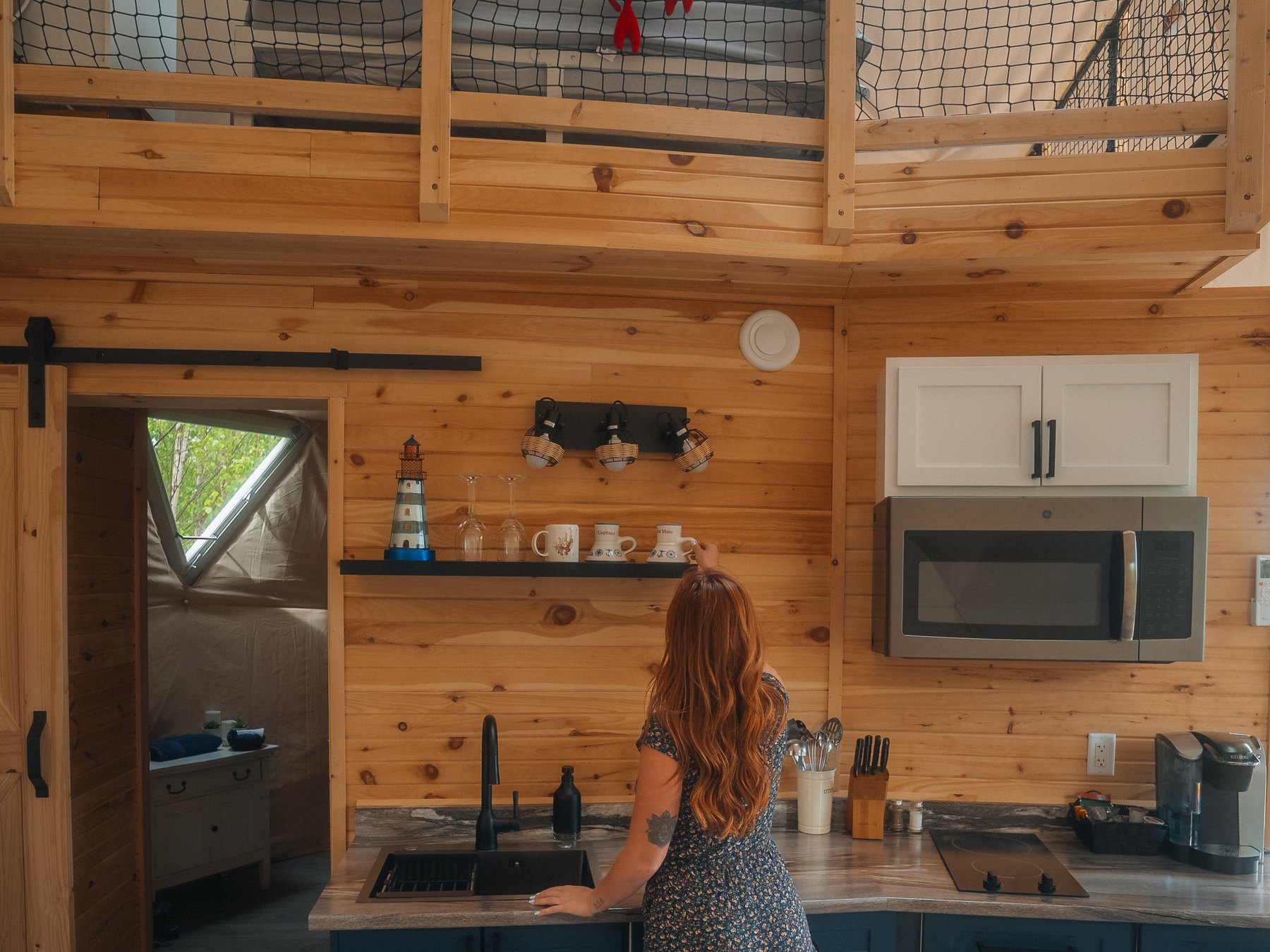 Harbor Haven — the kitchenette, with the loft nook above it