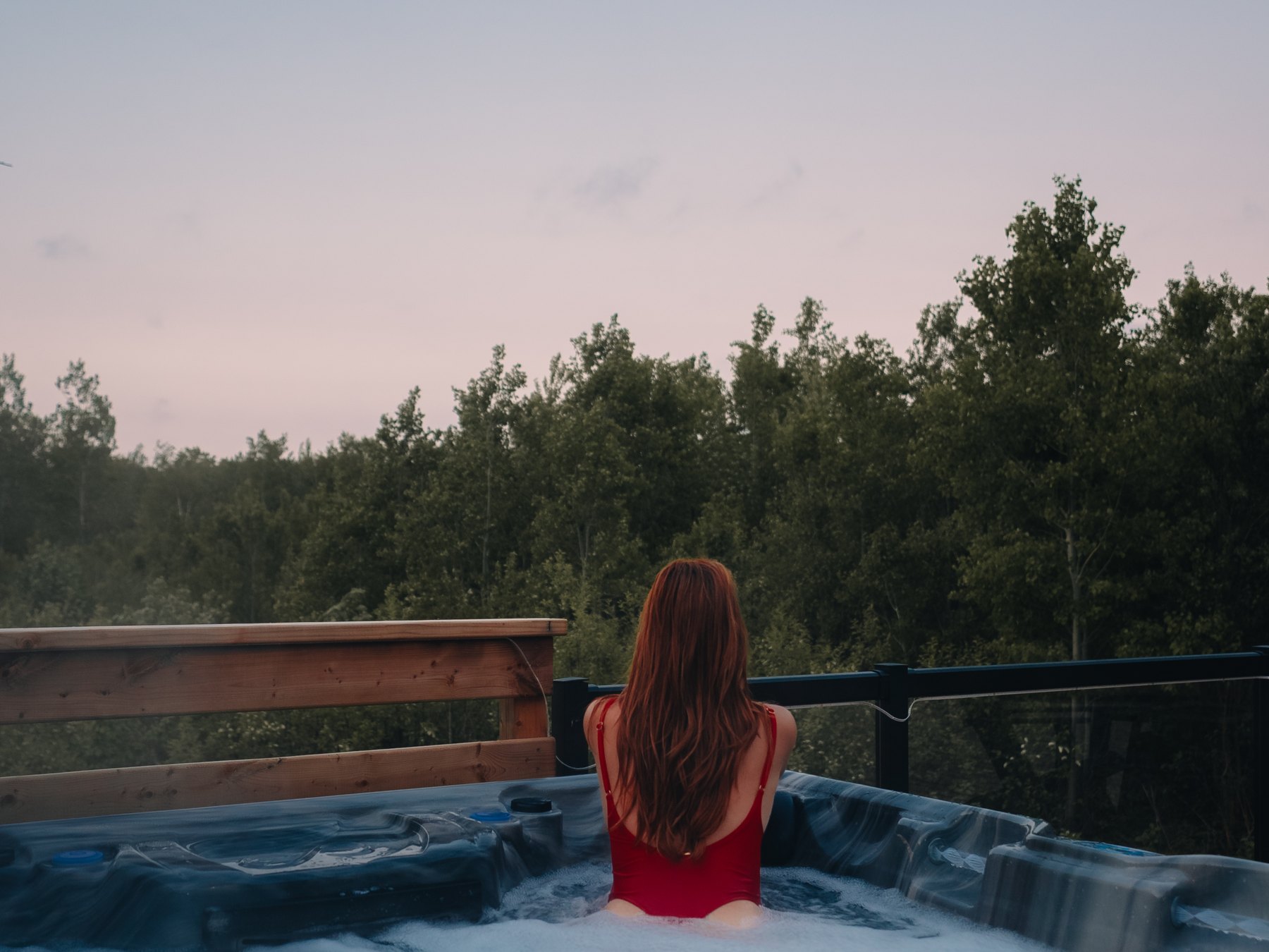 Harbor Haven — the moon rising over the treeline from the hot tub