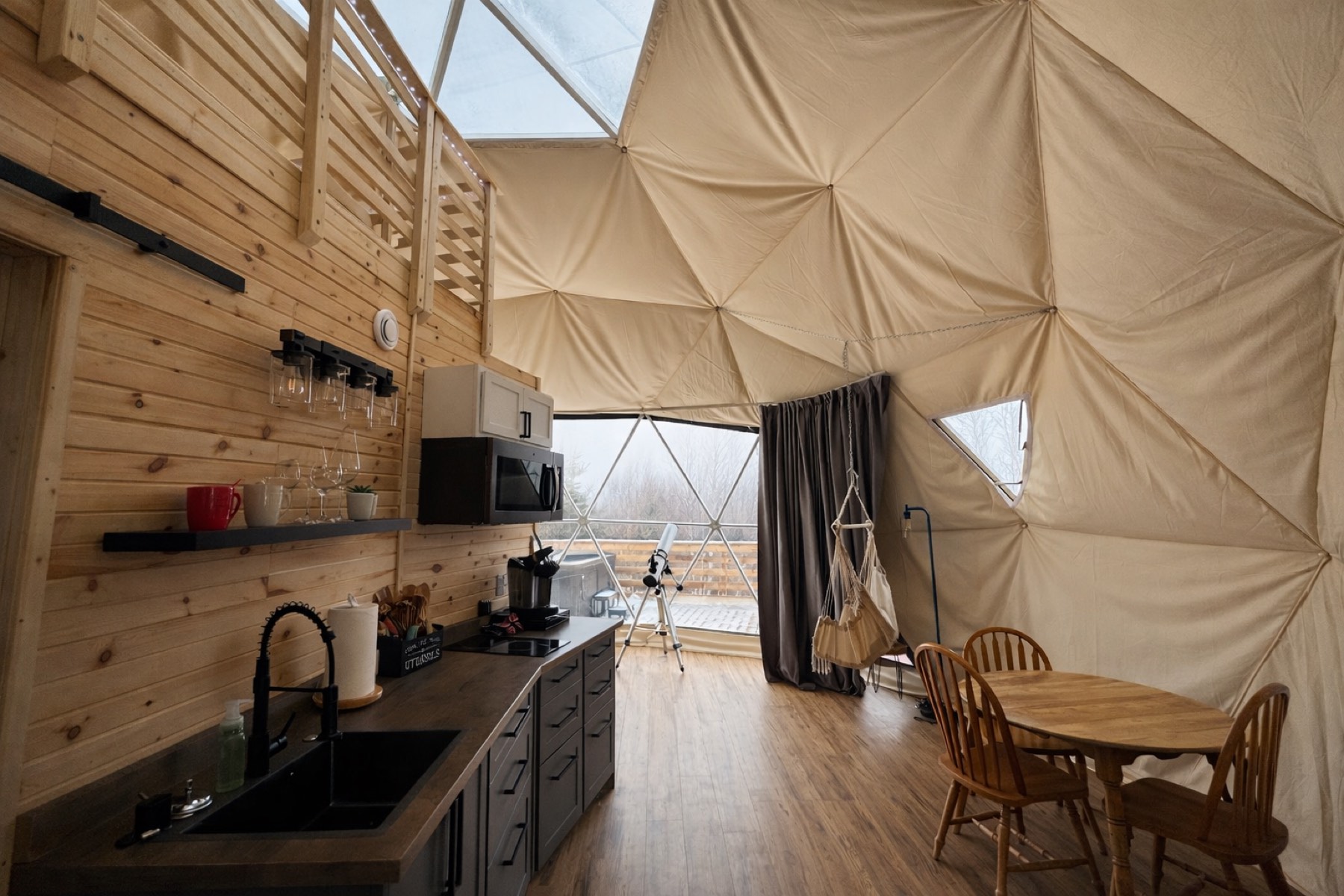 Dome kitchenette with mini fridge, coffee maker and dishware